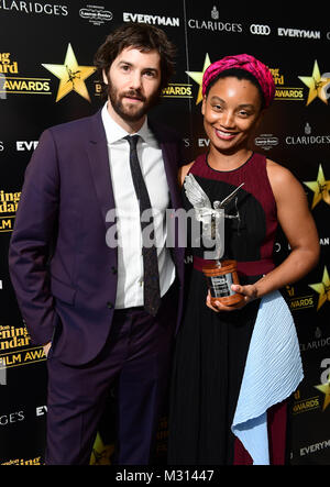 Rungano Nyoni, winner of the award for Breakthrough of the Year for her film I Am Not a Witch, with Jim Sturgess who presented her with the award at the Evening Standard British Film Awards at Claridges in London. Stock Photo