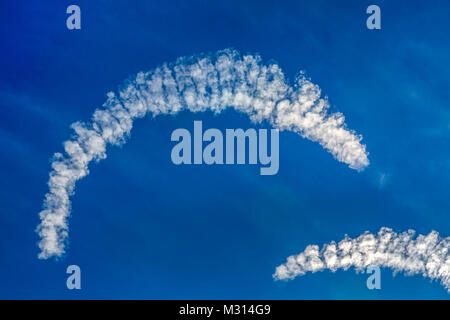Very unusual crescent-shaped clouds in a blue sky over New England in the USA. Stock Photo