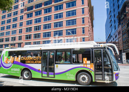 Baltimore Maryland,East Pratt Street,Charm City Circulator,bus,coach,free shuttle,stop,eco friendly,EcoSaver IV LF Hybrid Electric vehicle,low emissio Stock Photo