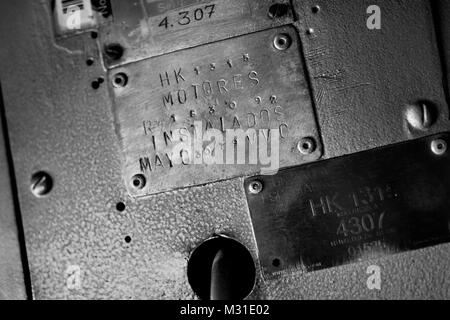 Data plates, showing the engines installation date, are seen in the cockpit of a Douglas DC-3 aircraft at the airport of Villavicencio, Colombia. Stock Photo