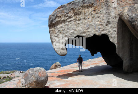 Geologist at Remarkable Rocks in Flinders Chase National Park Stock Photo
