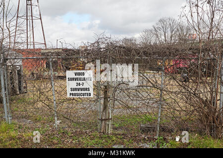 Video surveillance sign warning of 24 hour surveillance and prosecution if caught trespassing and surviving in Montgomery, Alabama USA. Stock Photo