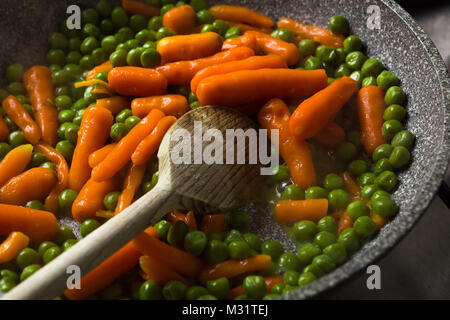 Steamed Organic Vegetable Medly with Peas and Carrots Stock Photo