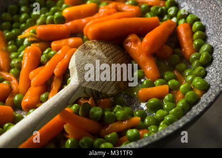 Steamed Organic Vegetable Medly with Peas and Carrots Stock Photo