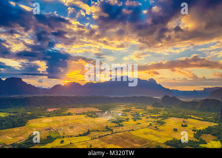 Aerial view of the fields and mountain. Beautiful landscape. Vang Vieng. Laos. Stock Photo