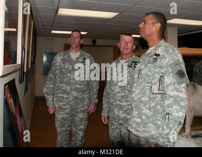 Gen. Vincent K. Brooks (right), U.S. Army Pacific Command commanding general, Command Sgt. Major Rodney R. Lewis (center), 1st Stryker Brigade Combat Team, 25th Infantry Division senior-enlisted leader and Col. Brian J. Reed (left), 1-25 SBCT commander, tour the brigade regimental room during Brooks’ first visit to Fort Wainwright since taking command of USARPAC. (Photo by Staff Sgt. Mylinda DuRousseau, 1-25 SBCT Public Affairs) 130731-A-SF654-004 by 1 Stryker Brigade Combat Team Arctic Wolves Stock Photo