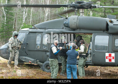 On November 2, Soldiers of the Maine Army National Guard’s Company C, 1st Battalion, 126th Aviation Regiment spent Nov. 2 in Northern Maine, working alongside Maine Park Rangers and representatives from Baxter State Park to airlift building supplies and raw materials to camping sites throughout the park.  The mission, dubbed “Operation Timberhook” involved moving materials such as cedar logs, firewood, propane tanks, and sand, to remote locations around the park for use in the renovation of old camping lean-tos around the park, and the construction of new ones near Wassataquik Lake. (Maine Arm Stock Photo