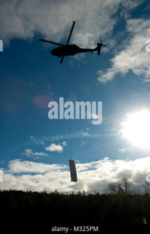 On November 2, Soldiers of the Maine Army National Guard’s Company C, 1st Battalion, 126th Aviation Regiment spent Nov. 2 in Northern Maine, working alongside Maine Park Rangers and representatives from Baxter State Park to airlift building supplies and raw materials to camping sites throughout the park.  The mission, dubbed “Operation Timberhook” involved moving materials such as cedar logs, firewood, propane tanks, and sand, to remote locations around the park for use in the renovation of old camping lean-tos around the park, and the construction of new ones near Wassataquik Lake. (Maine Arm Stock Photo