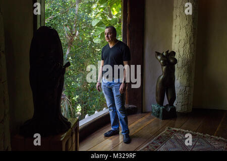 Carlos Mimenza, an entrepreneur, poses for a photo in one of his homes in Playa del Carmen, Mexico, on July 11, 2017. Mimenza represents a group of business owners who employ security forces to protect their businesses from extortion. This house is home to a team of computer experts who monitor people of interest. Stock Photo