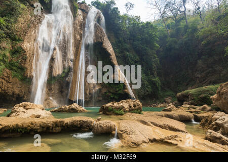 View of the tall Dat Taw Gyaint (also known as Anisakan) Waterfall near Mandalay in Myanmar (Burma) on a sunny day. Stock Photo