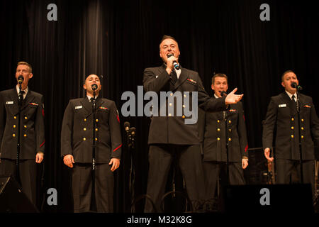 EDINBORO, PA (April 5, 2016) Musician 1st Class Michael Webb sings with the United States Navy Band Sea Chanters chorus during a concert at Edinboro University. The Sea Chanters are on a 22-day tour of the northeastern United States. (U.S. Navy photo by Chief Musician Melissa Bishop/Released) 160405-N-NW255-042 by United States Navy Band Stock Photo