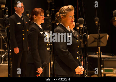 EDINBORO, PA (April 5, 2016) Musician 1st Class Susan Kavinski waiting to sing during a concert of the United States Navy Band Sea Chanters chorus at Edinboro University. The Sea Chanters are on a 22-day tour of the northeastern United States. (U.S. Navy photo by Chief Musician Melissa Bishop/Released) 160405-N-NW255-058 by United States Navy Band Stock Photo