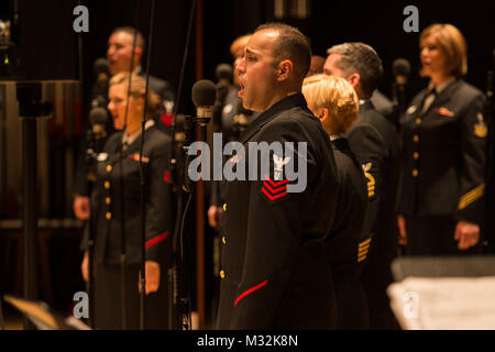 EDINBORO, PA (April 5, 2016) Musician 1st Class Dennys Moura sings with the United States Navy Band Sea Chanters chorus during a concert at Edinboro University. The Sea Chanters are on a 22-day tour of the northeastern United States. (U.S. Navy photo by Chief Musician Melissa Bishop/Released) 160405-N-NW255-076 by United States Navy Band Stock Photo