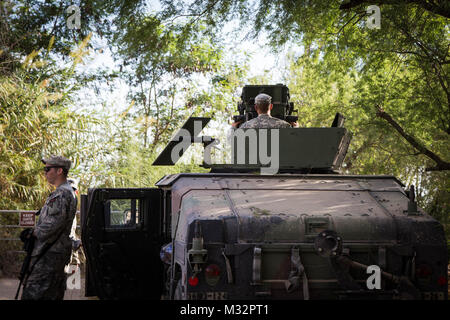 A soldier from the 36th Infantry Division, Texas Army National Guard, operates specialized equipment at the Texas-Mexico border. The soldier is serving in support of Operation Strong Safety. (U.S. Army photo by Maj. Randall Stillinger) 140824-A-AF730-235 by Texas Military Department Stock Photo