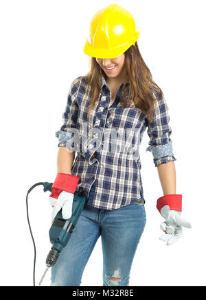 Attractive young woman builder with drill tool happy for good work. Isolated on white background. Stock Photo