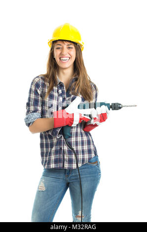 Attractive young woman builder with drill tool happy for good work. Isolated on white background. Stock Photo