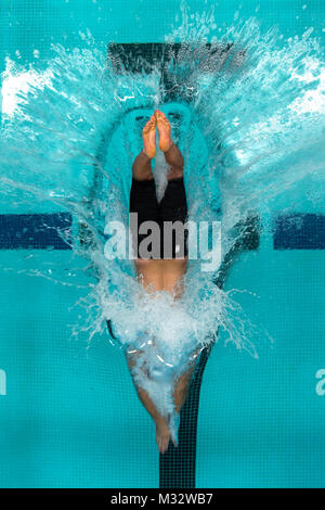 Air Force athlete Orion Orellana dives into a pool at the start of a race during the 2014 Warrior Games at the Olympic Training Center, Colorado Springs, Colorado, Sept. 30, 2014. The Warrior Games consists of athletes from throughout the Department Of Defense, who compete in paralympic style events for their respective military branch. The goal of the games is to help highlight the limitless potential of warriors through competitive sports. (U.S. Air Force photo by Airman 1st Class Scott Jackson) 140930-F-HF287-723 by Air Force Wounded Warrior Stock Photo