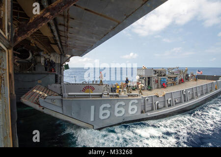 Landing Craft Utility (LCU 1666) docks inside the well deck of USS ...