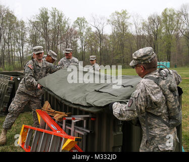 A Navy Tactical Operations Center (TOC) rests in a field aboard Naval ...