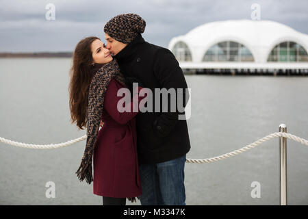 Happy young couple in love kissing outdoor Stock Photo