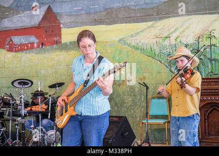Kutztown Pennsylvania,Kutztown Folk Festival,Pennsylvania Dutch folklife,music,musician,playing,entertainment,stage,perform,violin,fiddle,electric gui Stock Photo