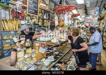 Pennsylvania Philadelphia South Philly South 9th Street,Italian Market imported products DiBruno Brothers,gourmet cheese deli salami olives,woman fema Stock Photo