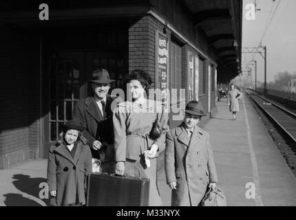 US family is ready for train travel, ca. 1944. Stock Photo