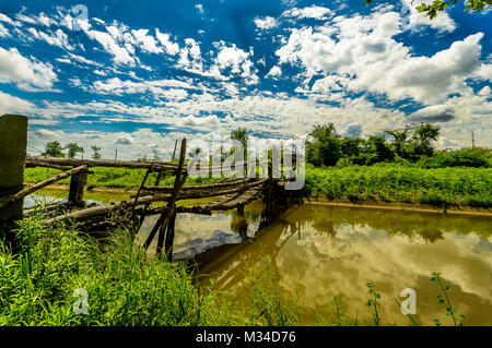 Old wooden bridge over a small river in a Georgian village, Stock Photo