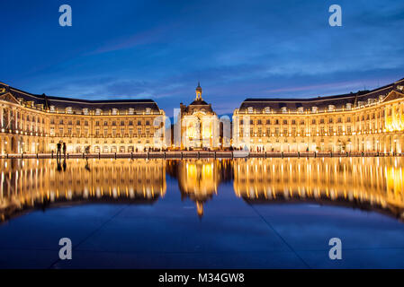 Place la Bourse in Bordeaux, the water mirror by night, France Stock Photo