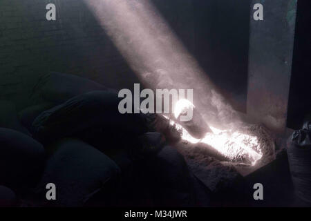 Jixi, Heilongjiang, China. 4th July, 2017. Bags of graphite and graphite dust inside a warehouse where graphite is processed. Graphite is a key component in the batteries that power electric cars. Credit: Dave Tacon/ZUMA Wire/ZUMAPRESS.com/Alamy Live News Stock Photo