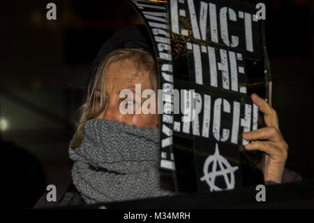 February 8, 2018 - London, UK. 8th February 2018. Class War protest outside The Shard this evening after defeating the attempt by lawyers representing the Qatari Royal Family who own the building to take out an injunction to prevent their protest. The protest was at the Shard as there are said to be ten Â£50 million pound apartments there which have remained empty since the building was completed at a time when London has a huge housing crisis with so many homeless and sleeping on the street. Class War aim to highlight the huge number of empty properties in London where there are so many large Stock Photo