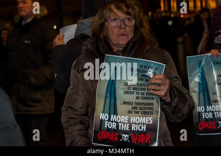 February 8, 2018 - London, UK. 8th February 2018. Class War protest outside The Shard this evening after defeating the attempt by lawyers representing the Qatari Royal Family who own the building to take out an injunction to prevent their protest. The protest was at the Shard as there are said to be ten Â£50 million pound apartments there which have remained empty since the building was completed at a time when London has a huge housing crisis with so many homeless and sleeping on the street. Class War aim to highlight the huge number of empty properties in London where there are so many large Stock Photo