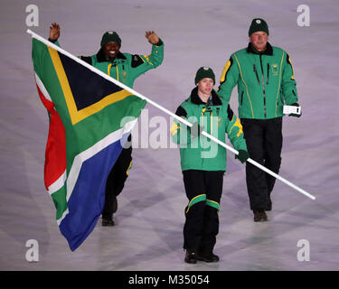 PyeongChang, South Korea. 9th Feb, 2018. The South Africa team marches in, led by flag bearer CONNOR WILSON during the Opening Ceremony for the 2018 Pyeongchang Winter Olympic Games, held at PyeongChang Olympic Stadium. Credit: Scott Mc Kiernan/ZUMA Wire/Alamy Live News Stock Photo