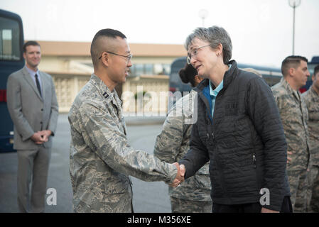 Secretary of the Air Force Heather Wilson coins Capt. Kevin Liu, 961st Airborne Air Control Squadron project officer, Feb. 2, 2018, at Kadena Air Base, Japan. Challenge coins are a military tradition in which a senior military leader or a member of a distinguished office acknowledges the awards, accomplishments or significant acts of a particular service member. (U.S. Air Force photo by Senior Airman Quay Drawdy) Stock Photo