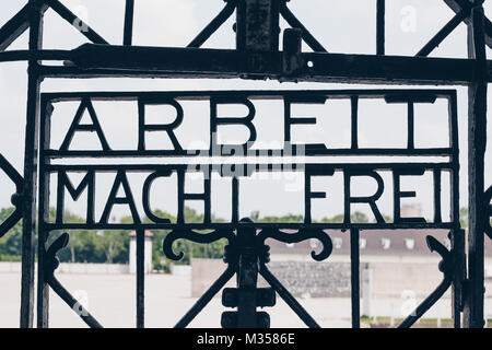 DACHAU, GERMANY - July 6, 2016 ; The Main gate of concentration camp with the sign ARBEIT MACHT FREI - Holocaust Memorial Museum. Stock Photo