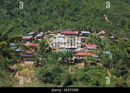 Traditional lao village landscape seen from the Mekong river in Laos Stock Photo