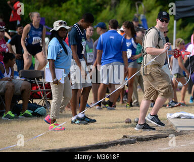 A Texas Army National Guard Recruit Sustainment Program member volunteers at the shot put competition July 31, 2015, at the Texas Amatuer Athletic Federation's Summer Games in College Station. About 75 Texas Guard's RSP warriors and the TXARNG's Recruiting and Sustainment Command supported the annual, five-day sporting event that hosted hundreds of athletes from around the state. (Air National Guard photo by 1st Lt. Alicia M. Lacy/Released) 150731-Z-NC104-115 by Texas Military Department Stock Photo