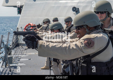 150801-N-MK881-245 SOUTH CHINA SEA (August 1, 2015) Sailors assigned to Surface Warfare Mission Package, Detachment 4, currently embarked aboard the littoral combat ship USS Fort Worth (LCS 3) participate in a live fire exercise on the ship’s forecastle. Currently on a 16-month rotational deployment in support of the Indo-Asia-Pacific Rebalance, Fort Worth is a fast and agile warship tailor-made to patrol the region’s littorals and work hull-to-hull with partner navies, providing 7th Fleet with the flexible capabilities it needs now and in the future. (U.S. Navy photo by Mass Communication Spe Stock Photo