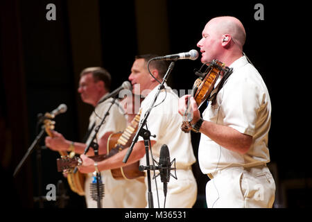 GLENDIVE, Mont. (Sept. 8, 2015) Senior Chief Musician Pat White, right, performs with the U.S. Navy Band Country Current at the Dawson County High School Auditorium in Glendive, Mont. The Navy Band's tour featured 14 performances in six states, reaching out to communities that don't normally see the Navy at work. (U.S. Navy photo by Chief Musician Adam Grimm/Released) 150908-N-LC494-058 by United States Navy Band Stock Photo