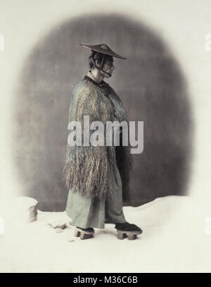 1860's Japan - portrait of a man in a straw rain coat Stock Photo