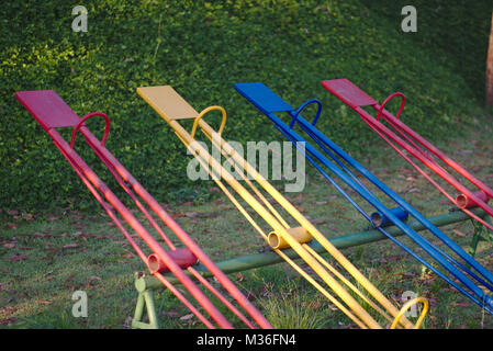 Four colorful seesaws at a playground. Stock Photo