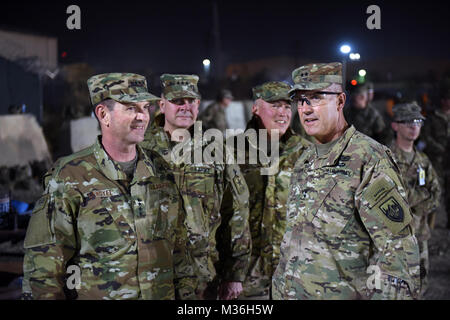 Air Force Gen. Joseph Lengyel, chief, National Guard Bureau; Army Lt. Gen. Timothy Kadavy, director, Army National Guard; Air Force Chief Master Sgt. Mitchell Brush, senior enlisted advisor to the chief of the National Guard Bureau; and Army Maj. Gen. John Thomson, commanding general, 1st Cavalry Division, watch toops play a flag footbal game during a Thanksgiving troop visit, Bagram Airfield, Bagram, Afghanistan, Nov. 23, 2016. (U.S. Army National Guard photo by Sgt. 1st Class Jim Greenhill) 161123-Z-DZ751-110 by Texas Military Department Stock Photo