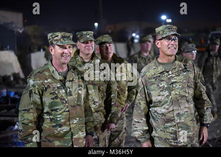 Air Force Gen. Joseph Lengyel, chief, National Guard Bureau; Army Lt. Gen. Timothy Kadavy, director, Army National Guard; Air Force Chief Master Sgt. Mitchell Brush, senior enlisted advisor to the chief of the National Guard Bureau; and Army Maj. Gen. John Thomson, commanding general, 1st Cavalry Division, watch toops play a flag footbal game during a Thanksgiving troop visit, Bagram Airfield, Bagram, Afghanistan, Nov. 23, 2016. (U.S. Army National Guard photo by Sgt. 1st Class Jim Greenhill) 161123-Z-DZ751-120 by Texas Military Department Stock Photo