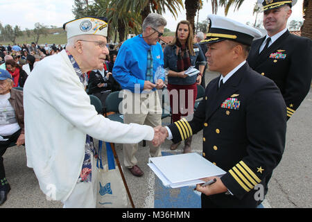 161207-N-HW977-027 NORCO, Calif. (Dec. 7, 2016) Pearl Harbor survivor John Busma, age 99, left, is welcomed by Capt. Noel J. Dahlke, commanding officer of Naval Weapons Station Seal Beach (NWSSB), before the 10th annual Pearl Harbor Remembrance event at NWSSB Detachment Norco. Held near the historic Lake Norconian Conference Center, the event marks the 75th anniversary of the Japanese attack on Pearl Harbor and 75 years of Navy presence in Riverside County, first as a naval hospital serving the wounded from Pearl Harbor, and currently as the home of the Navy's independent assessment agent, Nav Stock Photo