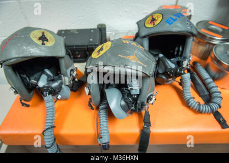 Helmets belonging to pilots of 82nd Aerial Target Squadron Detachment 1 sit on a table in the 82nd ready room at Holloman AFB, N.M., Dec. 16, 2016. Pilots of the 82nd participated in the retirement flight and ceremony for the final variant of the Phantom II, the QF-4 unmanned aerial target flown by the 82nd at Holloman AFB.The F-4 Phantom II entered the U.S. Air Force inventory in 1963 and was the primary multi-role aircraft in the USAF throughout the 1960s and 1970s. The F-4 flew bombing, combat air patrol, fighter escort, reconnaissance and the famous Wild Weasel anti-aircraft missile suppre Stock Photo