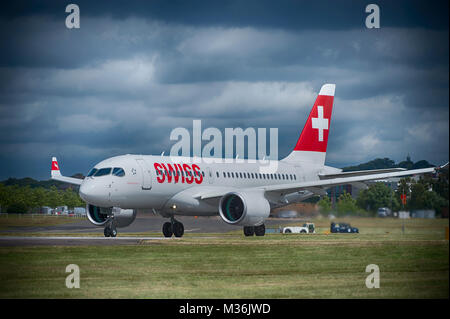 Bombardier’s first 125 seat CS100 aircraft supplied to airline operator Swiss takes off from The Farnborough International Trade Show Stock Photo