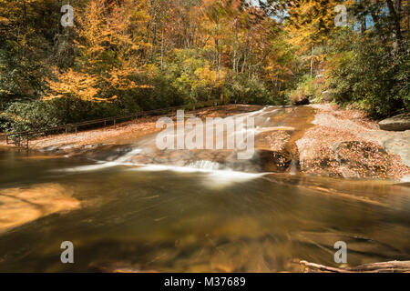 Sliding Rock Waterfall in the Appalachian mountains of western North Carolina in great fall colors Stock Photo