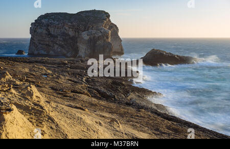 Gozo Island cliffs with Fungus Rock during the spring storm. Dwejra, Maltese archipelago