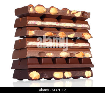 Broken chocolate bars with nuts on white background Stock Photo