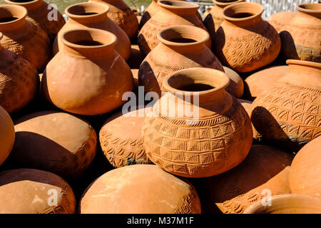 Pottery is made and drying in the sun at the outskirts of the city near the Irrawaddy River Stock Photo